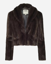 A dark brown cropped fur jacket with a wide collar and long sleeves, shown flat against a light grey background.