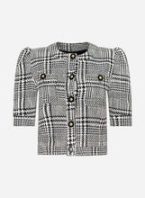A black and white plaid tweed jacket with puff sleeves, a round neckline, and decorative gold-tone buttons, shown against a light grey background.