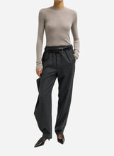 Dark grey flannel high-waisted trouser pants with a black belt on a light grey background