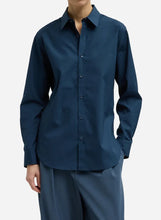 Navy blue long sleeve collared button up shirt