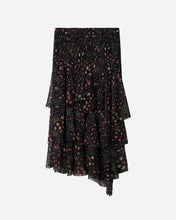 Black skirt with floral pattern and tiered drape on a light grey background
