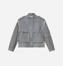 A light gray corduroy utility jacket with a stand collar, button front, and multiple flap pockets, displayed flat against a light gray background.