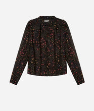 A long-sleeve black blouse with a dense, small-scale multicolor floral print shown against a plain light gray background.