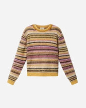 Multicolored yellow, pink, brown, and white striped sweater on a light grey background