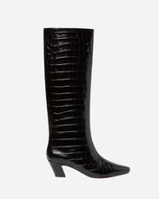 A black knee-high boot with a glossy crocodile-embossed texture, a pointed toe, and a low block heel, shown against a light gray background.
