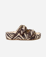 Platform zebra print sandal with two straps on a light gray background