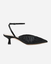 A single black satin pointed-toe mule sandal with a low kitten heel and a thin ankle strap, shown in profile against a light gray background.