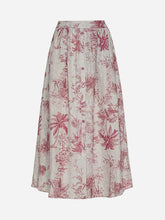 White skirt with a pink floral pattern and buttons running down the middle on a light grey background