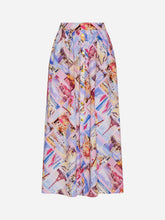 Colorful patterned skirt with buttons going down the center on a light grey background