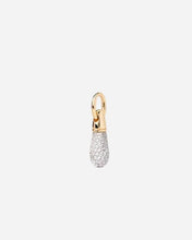 Gold and silver teardrop-shaped pendant on a light gray background
