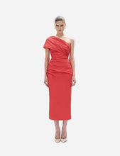 Woman wearing a red one-shoulder dress 