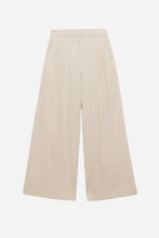 Cream wide-leg pants on a light grey background