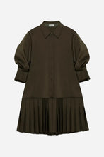 A dark brown mini dress with a pointed collar, balloon sleeves, and a pleated skirt, shown against a light gray background.