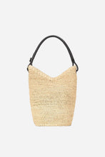 Beige woven handbag with black handle on a light grey background