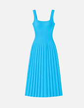 Blue knit dress on a light gray background