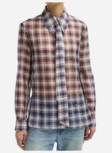 Plaid collared silk shirt worn by a person on a light grey background