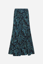 A flared midi skirt featuring an intricate abstract floral pattern in teal blue and light green over a black base, shown against a light grey background.