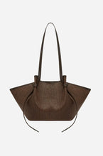 Brown handbag on a light gray background