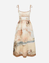 Floral and landscape print dress on a light gray background